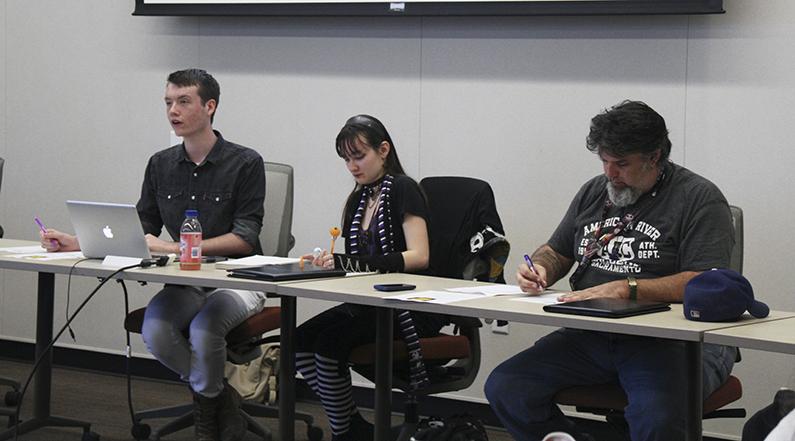 ASB Clubs and Events Board President Justin Nicholson, left, speaks about plans for the upcoming club day during the Oct. 13 board meeting as Vice President Mary Stedman and Director of Communications Bruce Rand take notes.  Octobers club day will have the theme of haunted harvest.(Photo by Noor Abasi)