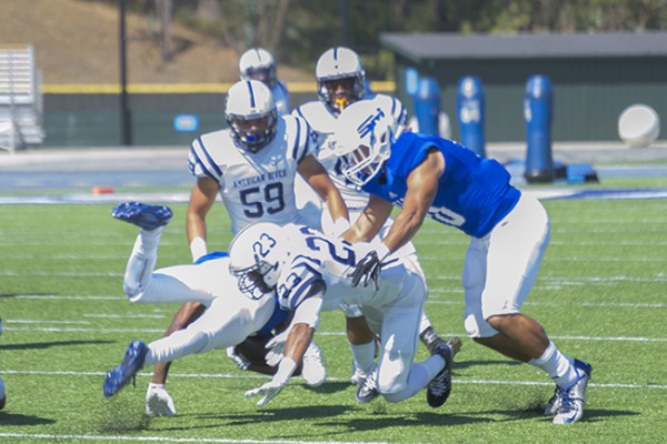 American RIver College defensive back Josh Huston tackles the running back from College of San Mateo on Oct. 3, 2015 at San Mateo. ARC lost to CSM 42-10. (photo by Joe Padilla)