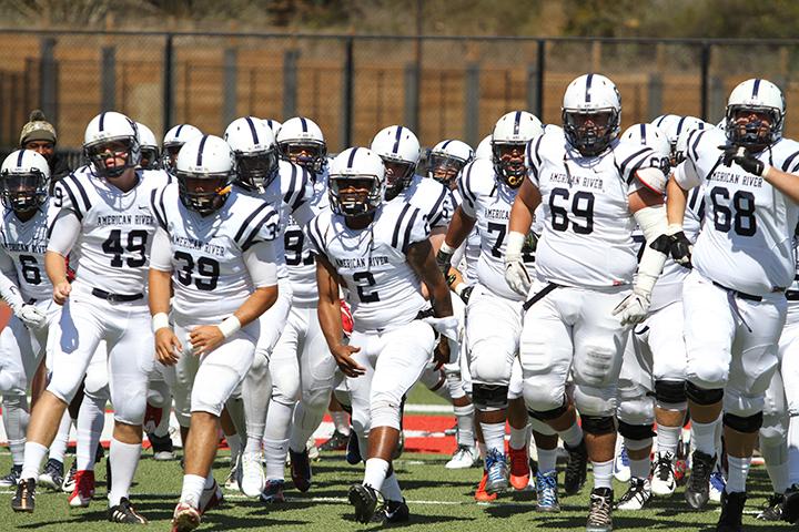 American River Colleges football team rushes on to the field at City College of San Francisco before its 20-17 win over CCSF on Sept. 26. ARC is 3-2 after a 42-10 loss at the College of San Mateo on Oct. 3 and will play College of Siskiyous for first place in the National NorCal conference. (Photo by Barbara Harvey)