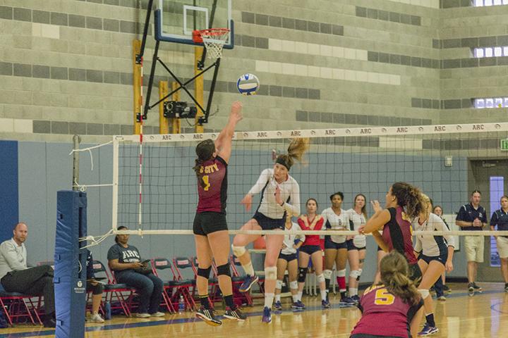 American RIver College libero and defensive specialist Nora Troppmann scores over Samantha Kepler of Sacramento City College during her teams match at home on Oct. 2, 2015. ARC went on to win the match 3 games to none. (photo by Joe Padilla)