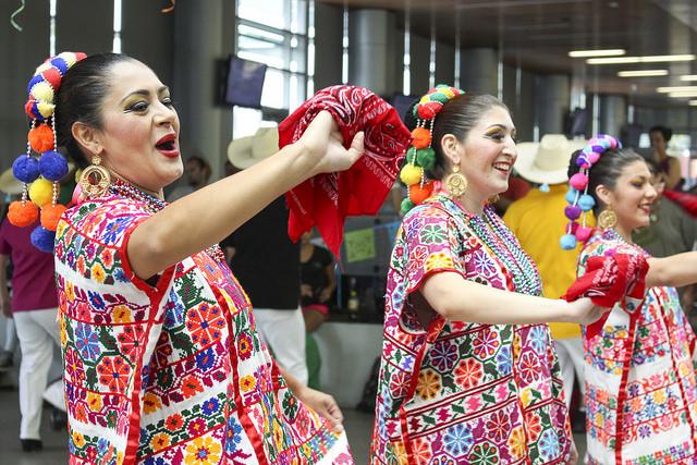 Dancers from the Los Altenos Dance Troop wave to the students gathered to watch their performance in the Student Center during the Latino Heritage Celebration on Thursday, Oct. 8, 2015. (Photo by Barbara Harvey)