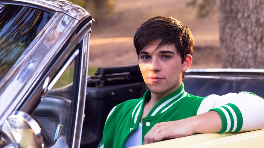 Sean O’Donnell sits in a convertible mustang while on set of “Mamaboy.” O’Donnell plays the role of a male high school student who becomes the first successful human experiment that causes him to be able to become pregnant. (Photo courtesy of My Hero Productions)