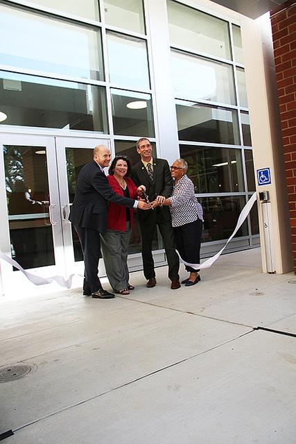 (Left to right) President Thomas Greene, Los Rios trustee Deborah Ortiz, Chancellor Brian King, Los Rios trustee Pamela Haynes cut the ribbon offically opening the new Student Services building. The new wing of the Student Services adds 5,500-square feet to the building. The west side underwent a 14-month remodel from April 2014 to summer 2015. (Photo by: Ashley Nanfria)