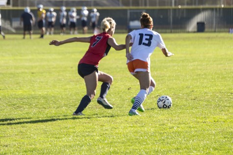 Savannah Watson of American River College and Breona Robinzine of Cosumnes River College go after the ball during their match at ARC on Oct 16.  (Photo by Joe Padilla)