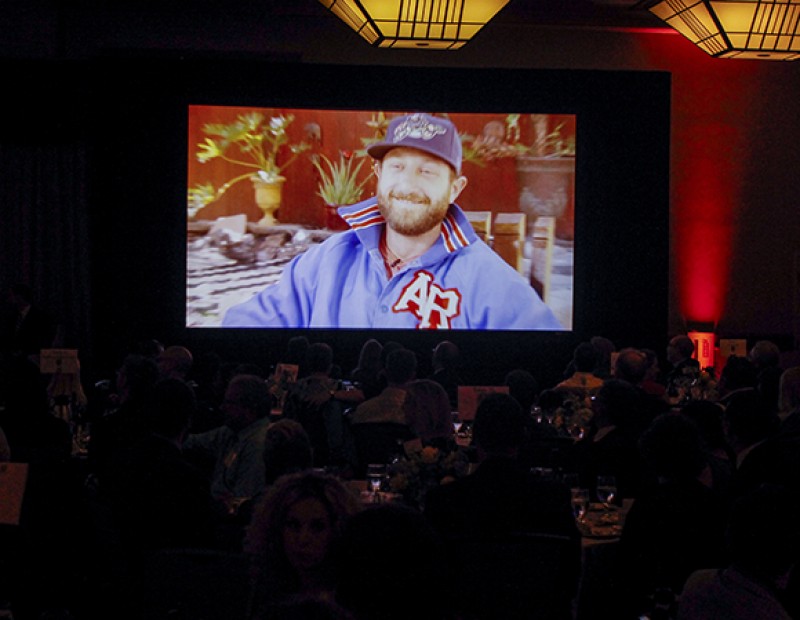 Attendees of the Los Rios Foundation Honors and Awards Gala watch a video featuring Dallas Braden, a former player for the Oakland Athletics and American River College alumnus. Braden was a guest at the gala where he was one of four alumni honored by the foundation on the occasion of the Los Rios district’s 50th anniversary. (Photo by John Ferrannini)