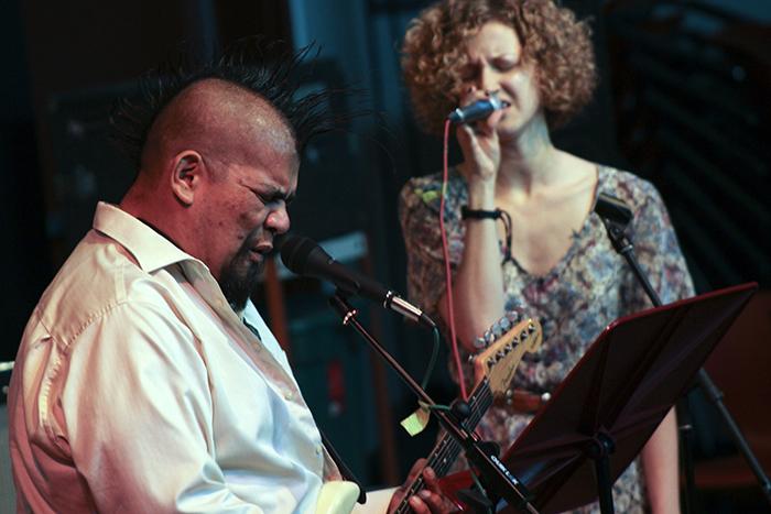 James Jimbo Estrella plays guitar with Katya Novskaya at the Acoustic Cafe with Katya Novskaya on Oct. 23, 2015. Estrella dedicated a song to West Arkeen, a musician who is credited for writing several songs for Guns N Roses who died from an heroin overdose. (Photo by Joseph Daniels)