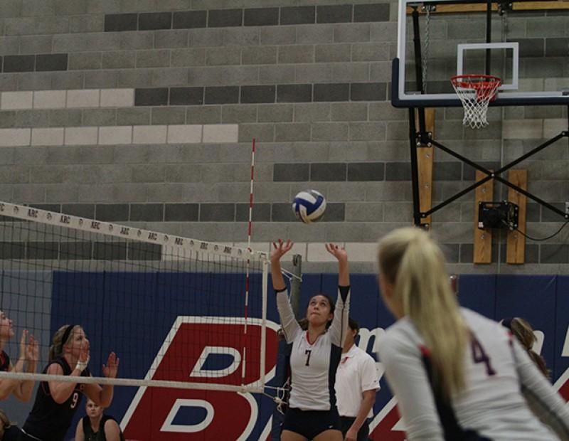 Safety Monica Udahl sets the ball for a teammate as American River College advances past Cosumnes. ARC offensive hitter/middle blocker Dani Schoen gazed upon her teammates execution of  the play on October 21, 2015.(Photo by Nicholas Corey)