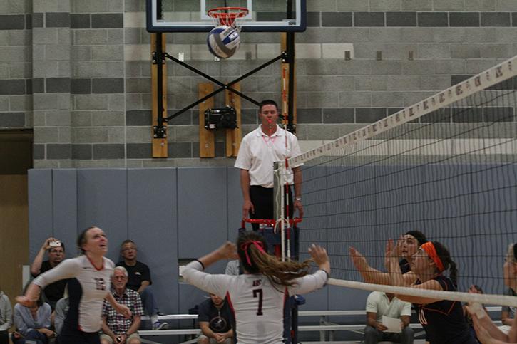 Safety Monica Udahl sets the ball for teammate and middle blocker for American River College Erin Fogerty. ARC won its match 3-0 by scores of 25-14, 25-11, 25-22 on October 21, 2015. (Photo by Nicholas Corey)