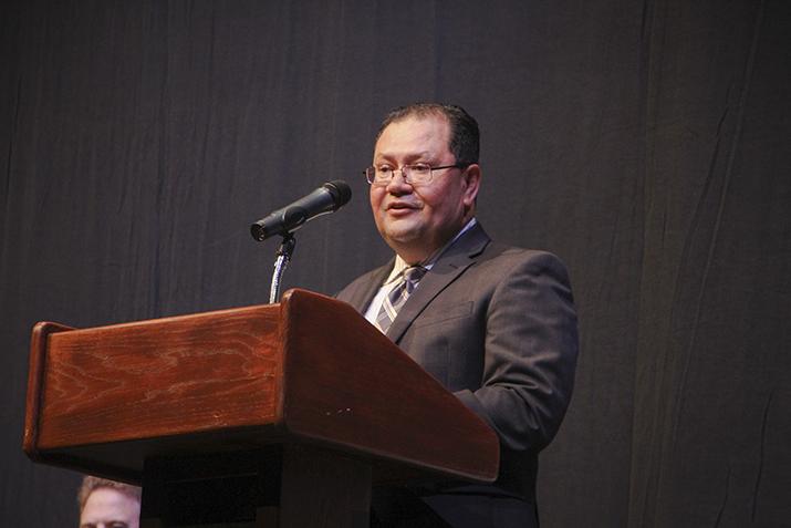 Marvin Martinez, the chair of the 12-member accreditation visiting team, presents the teams findings in the American River College Theater on Thursday. Martinez told ARC administration, faculty, staff and students what they were doing well on and what needed to improve at the college. (Photo by John Ferrannini)