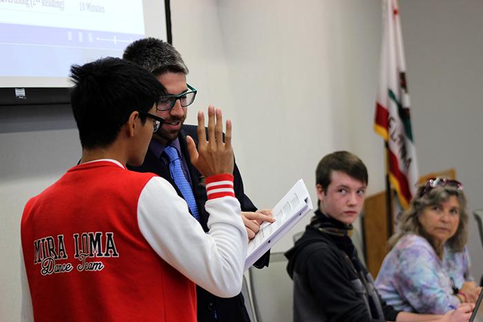 Sen. Kevin Phan, left, is sworn into the Student Senate at Thursdays meeting by David Hylton, who is acting as Senate president following the unexpected resignation of Garrett Kegel. (Photo by Joseph Daniels)