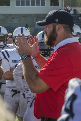 American River College head coach Jon Osterhout gives his team a pep talk after their game at College of San Mateo on Oct. 3. The AR Beavers lost the game 42 to 10. (photo by Joe Padilla)