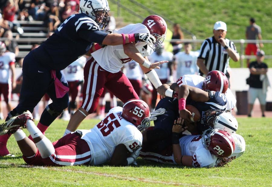 American River College quarterback Jihad Vercher is brought down by the Sierra College defense during ARC’s 47-22 victory over rival Sierra College on Saturday, Oct. 31, 2015. (Photo by Barbara Harvey)