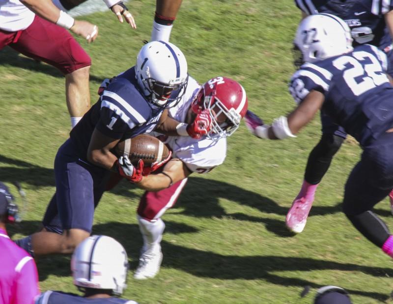 American River College’s Khalil Hudson drives through a tackle from Sierra College’s Andrew Lackowski during their game on Oct 31 at ARC. The Beavers won the game forty-seven to twenty-two. (Photo by Joe Padilla)