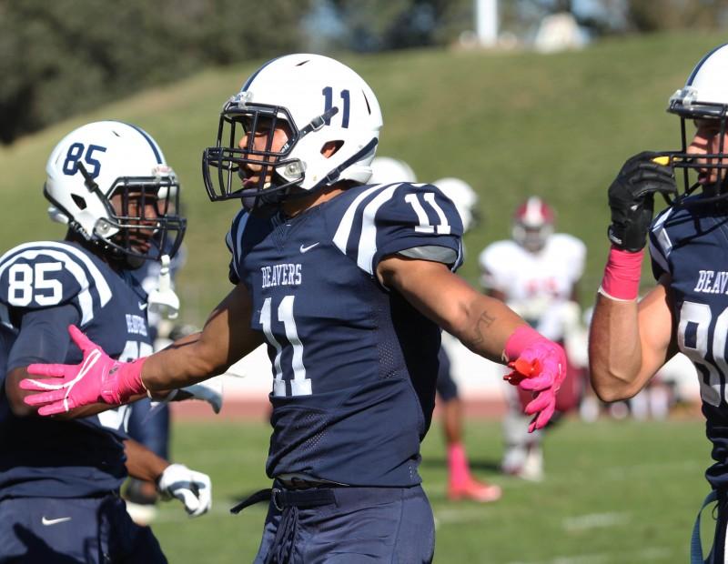 American River College football wide receiver Zack Suarez celebrates after wide receiver Marc Ellis catches a 34-yard pass from quarterback Jihad Vercher during ARC’s 47-22 victory over rival Sierra College on Saturday, Oct. 31, 2015. (Photo by Barbara Harvey)