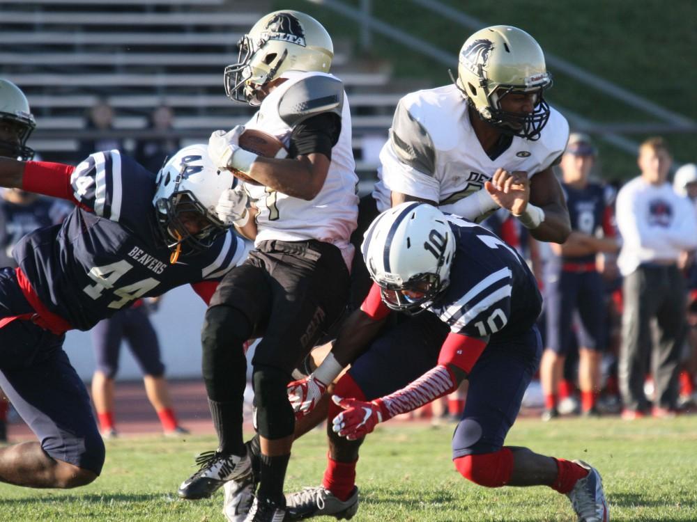 American River College linebacker Jim Carter and defensive back Drew Andrews attempt to bring down the San Joaquin Delta College ball carrier during the Gridiron Classic Bowl game on Saturday, Nov. 21, 2015. ARC lost 24-17 to SJDC in overtime. (Photo by Barbara Harvey)