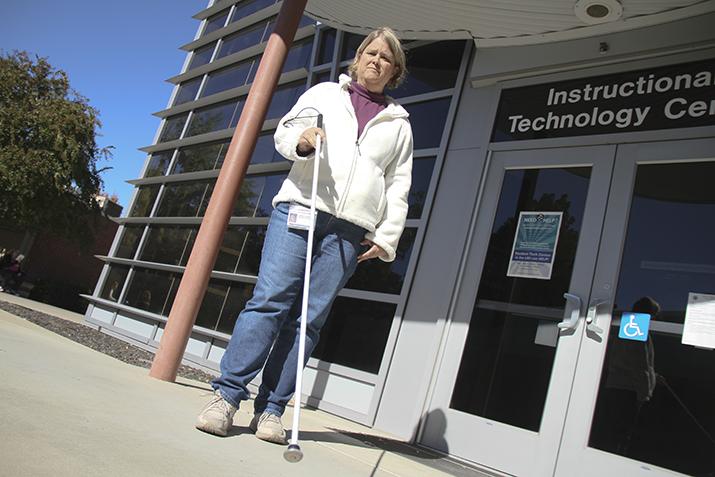 American River College Computer Instructional Assistant Tiffany Manosh stands outside the Instructional Technology Center with her new walking cane. Manosh, who is visually impaired, had her previous cane snapped by someone who stepped on it as she exited the bathroom in the Liberal Arts breezeway. (Photo by Matthew Peirson)