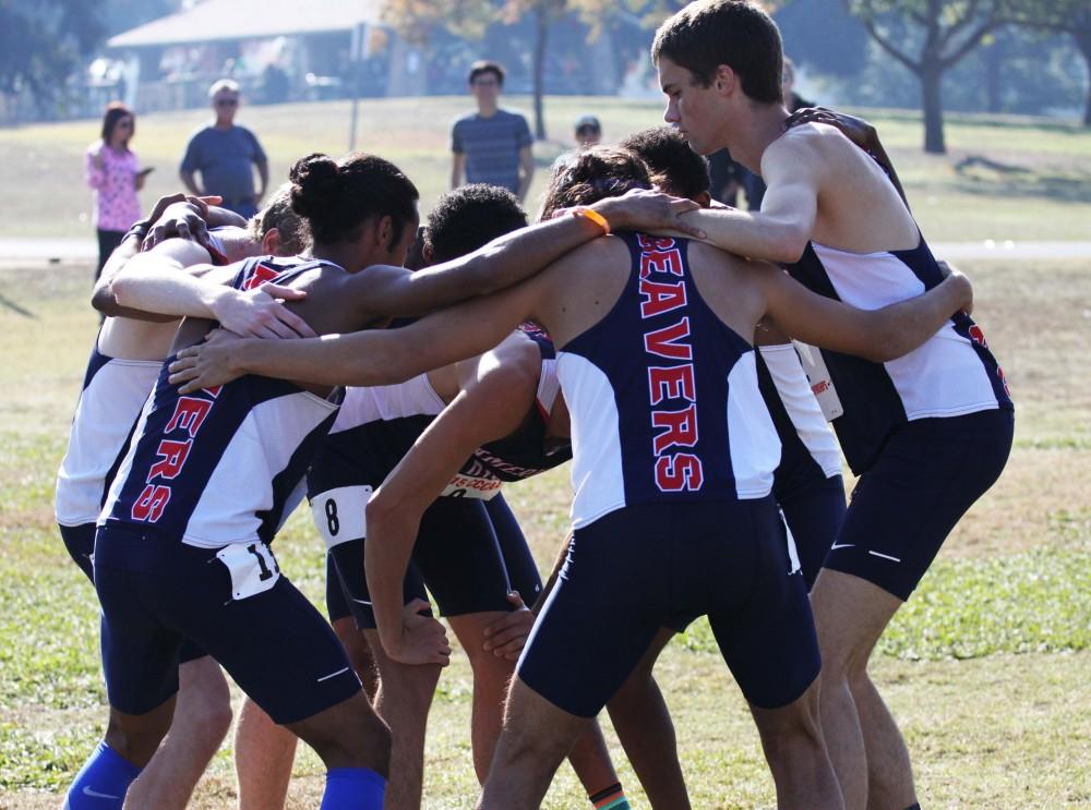 The American River College cross-country team huddles up before they run in the California State Championship meet. ARC won the meet for the teams fourth state championship in five years. (Photo courtesy of Rick Anderson)