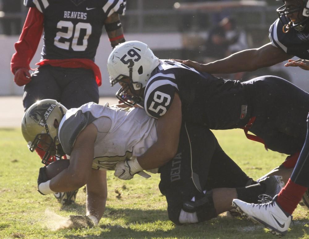 ARC linebacker Jordan Kunasyzk tackles SDJC tight end Johhny Weirnicki during the Gridiron Classic Bowl on Saturday, Nov. 21, 2015. ARC lost 24-17 in overtime. (Photo by Jordan Schauberger)