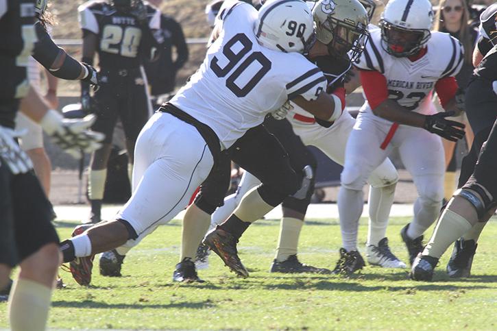 Defensive lineman Nick Terry and the rest American River College’s defense converges on a ball carrier for Butte on Nov. 7, 2015. Terry racked up 5 total tackles, one of which was for a 3-yard loss in the 27-24 defeat. (Photo by Nicholas Corey)