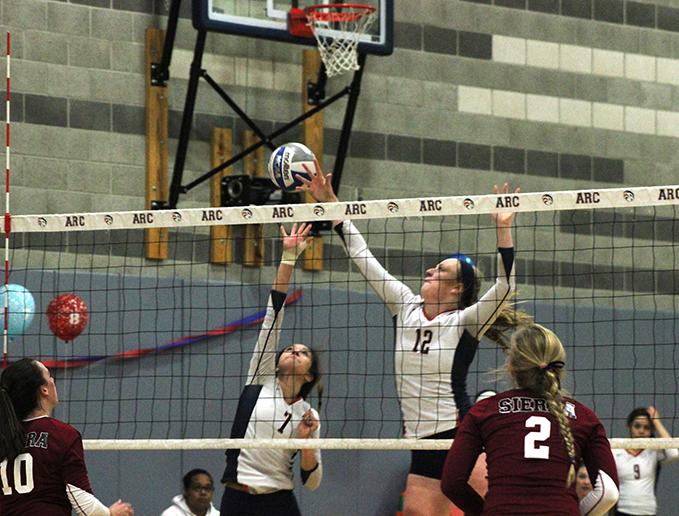 Erin Fogarty and Monica Udahl of American River College attempt to block a ball from Sierra College on Nov. 13, 2015. ARC lost to Sierra by a score of 25-23, 25-21, 25-18, 25-20. (Photo by Nicholas Corey)