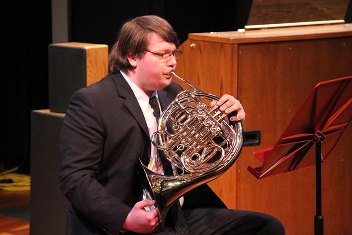 Peter Carter-Grassly  plays the french horn in an applied music recital at American River College. The next recital will take place on Thursday. (Photo by Michael Pacheco)