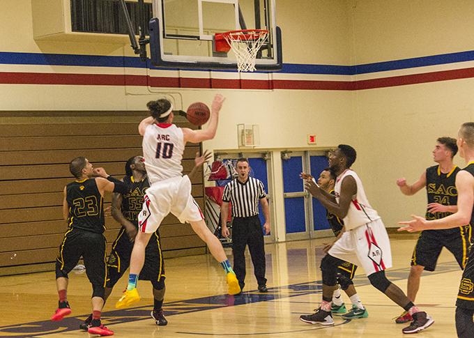 Austin Lobo grabs a rebound for American River College, during their game against Sacramento City College Tuesday. ARC lost the game 98-84. (Photo by Joe Padilla)