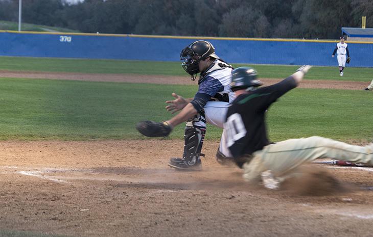 Peter Shearer of Feather River College scores the winning run against American River College in the bottom of the 13th inning at ARC. ARC lost the game 7-6. (Photo by Joe Padilla)