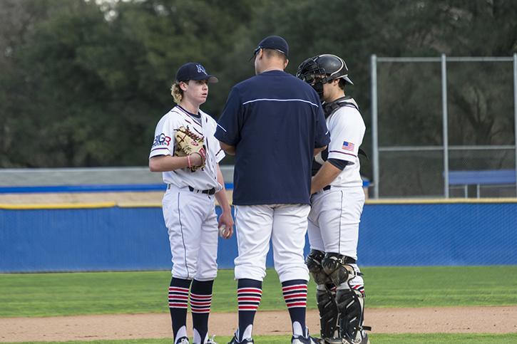 American River College pitching coach Preston Vancil talks with starting pitcher Andrew Wiesenfarth and catcher Matt Elliot in Saturdays 12-11 loss to West Valley College. Wiesenfarth walked 6 batters and took a no decision in the loss for ARC. (Photo by Joe Padilla)