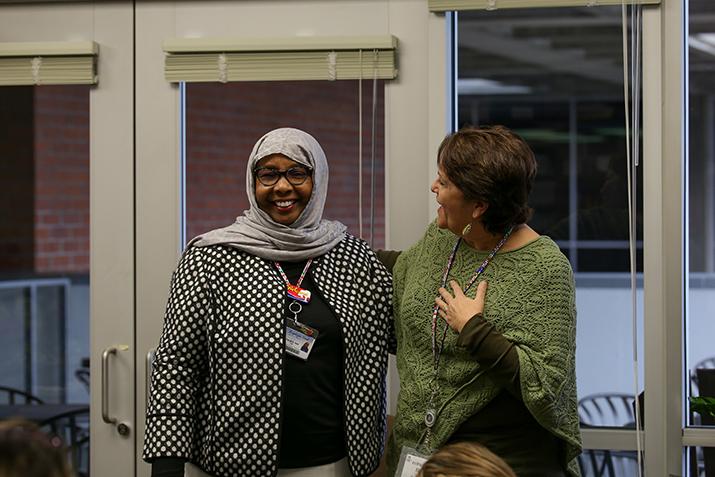 EOP and CARE coordinator Diane Delgado (right) talks about award recipient Faryal A. Said (left). Deserving teachers were presented with an award Thursday that was voted on by students at American River College. (Photo by Kyle Elsasser)