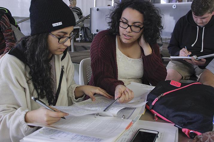 Amirah Arabi (left), Aminah Arabi (center), and Matthew Spencer (right) study together at the Student Center on the American River College campus in Sacramento, California on Feb.9, 2016. (Photo by Hannah Darden)