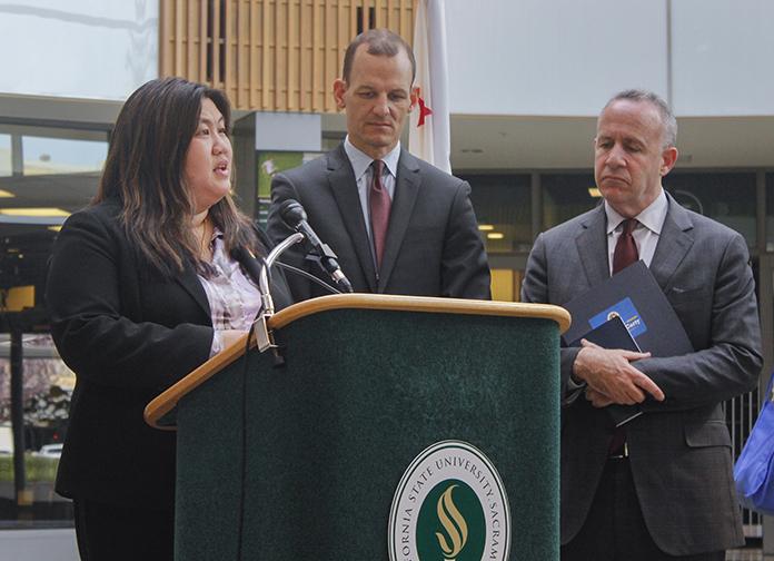 Sacramento City College professor Belinda Lum (left) speaks at a press conference announcing Assembly Bill 2017 at Sacramento State University in Sacramento, California on Feb. 25, 2016 as former California State Senator Darrell Steinberg (right) and California State Assemblyman Kevin McCarty (center) watch. The bill will help fund mental health services on community college campuses across the state. (Photo by Hannah Darden)