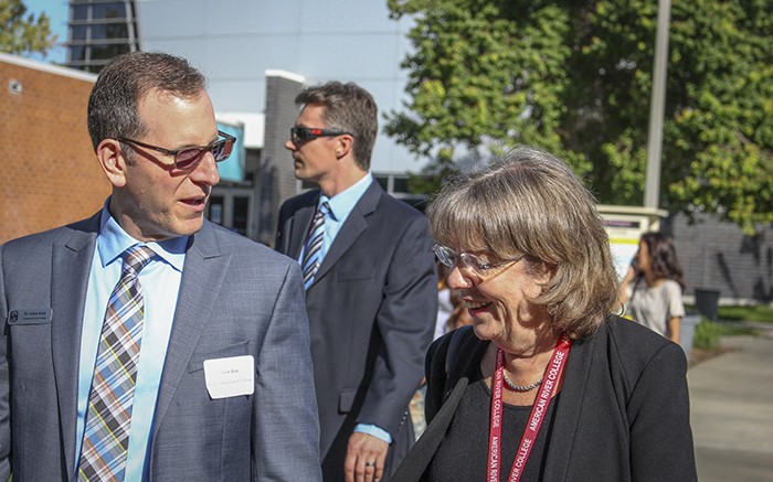 American River College Dean of planning, research and technology Adam Karp speaks with an accreditation committee member during last falls committee visit. The school was commended in seven areas. (File Photo)