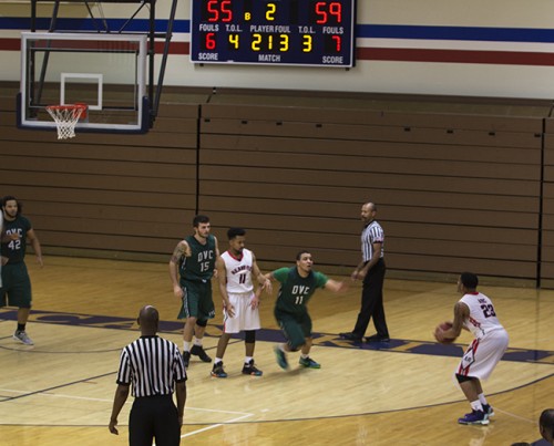 ARC guard Marcelas Perry stands between two DVC players as ARC guard Chasen Williamson prepares to shoot and uncontested 3-pointer. (Photo by Allante Morris)