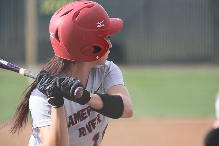 American River college catcher Katie Kapler prepares to swing at a ball during a game against Lassen College at ARC on Thursday Feb. 25, 2016. ARC won 6-3. (Photo by Jordan Schauberger)