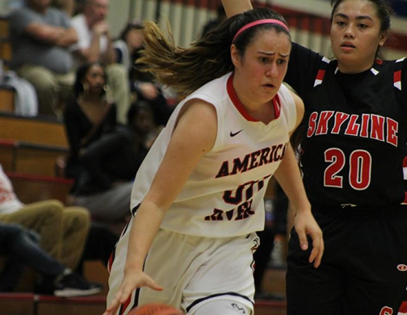 American River College forward Bengu Atik dribbles while Skyline’s Alyssa Dela Cruz defends during a playoff game on Wednesday Feb. 24, 2016. ARC lost 78-59. (Photo by Mack Ervin III)
