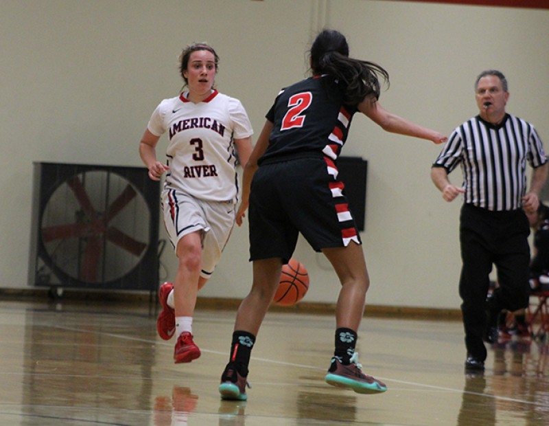 Skyline’s Ariana Sheehy defends American River College guard Jennifer Manduca during a playoff game on Wednesday Feb. 24, 2016. ARC lost 78-59. (Photo by Mack Ervin III)
