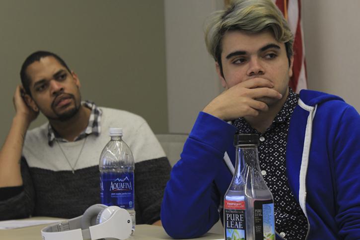 American River College CAEB Director of Finance James Cortright listens to the agenda with Jeremy Diefenbacher at the Student Senate meeting on March 1, 2016. (Photo by Robert Hansen)