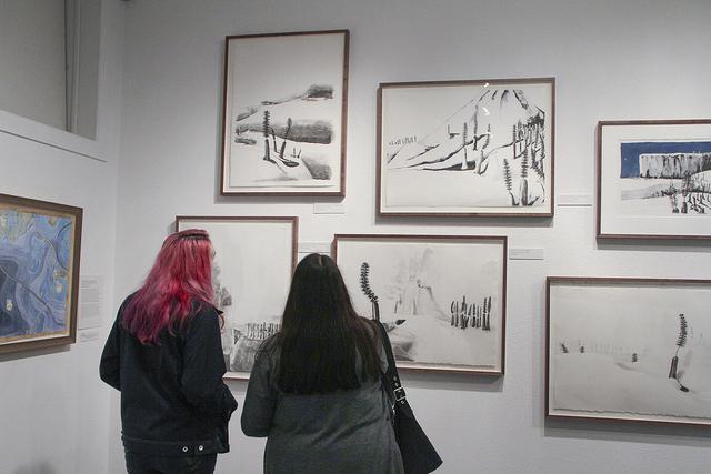 Inoa Spyres (left) and Salina Herrera-Spyres (right) observe art by Kathy Aoki at the James Kaneko Gallery on March 3, 2016. (Photo by Hannah Darden) 