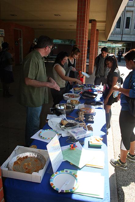 Students line up for a slice of pie at last years Pi Day, March 12, 2014. (Photo by Alexander Panasenko)