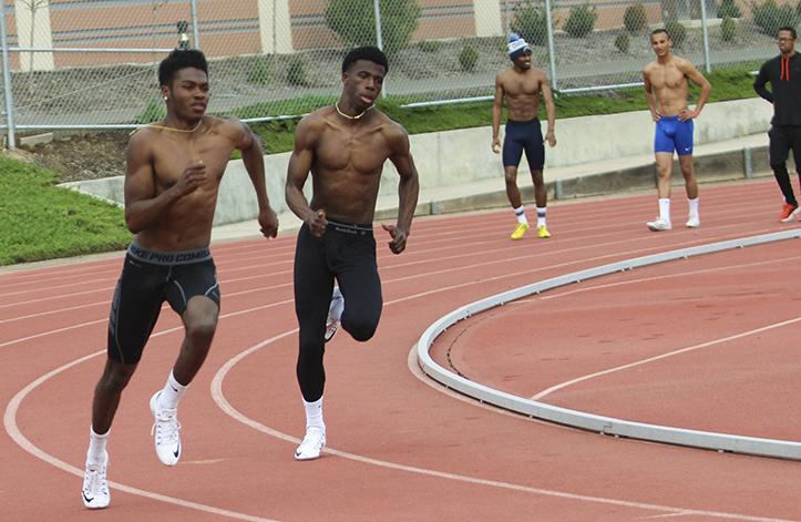 Isaiah Griffin (center left) runs during track and field practice on March 10, 2016 at the American River College Beavers stadium. Griffin has seriously progressed during his time at ARC to become one of the teams top sprinters. (Photo by Itzin Alpizar)