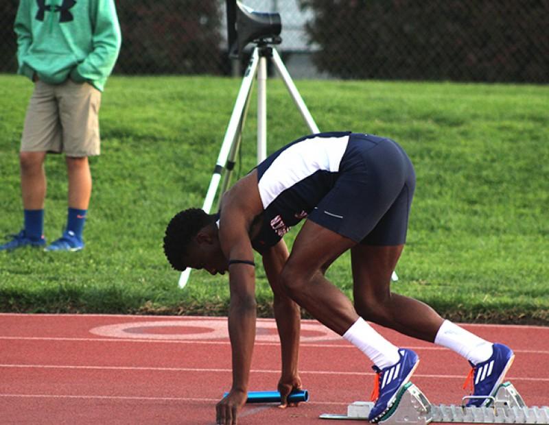 American River College sprinter Isaiah Griffin prepares to break from the blocks for the men’s 4×400 relay at the American River Invitational on March 26, 2016 at ARC. Griffin and the ARC team finished 3rd with a time of 3:15.36. (Photo by Mack Ervin III)