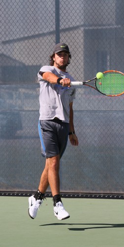 American River College men's tennis player Dylan King leaps to return the ball during practice on Mar. 30, 2016 at ARC. The team is preparing for the BIG 8 North Conference Tournament this Thursday Santa Rosa, California. (Photo by Matthew Nobert)