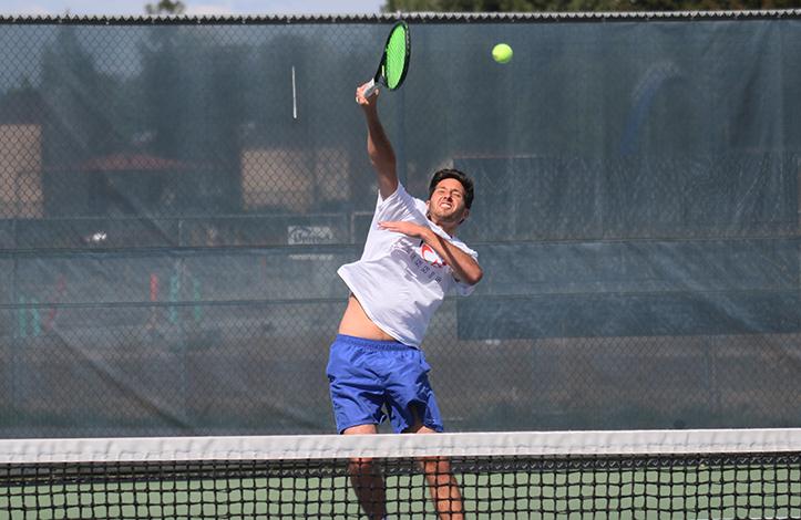American River College mens tennis player TJ Aukland jumps up to return the ball during practice on Mar. 30, 2016 at ARC. The team will be traveling to Santa Rosa this Thursday for the BIG 8 North Conference Tournament. (Photo by Matthew Nobert)