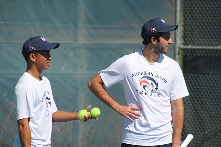 American River College teammates Cody Duong (left) and TJ Aukland (right) talk in between points during a game against Santa Rosa Junior College on March 15, 2016 at ARC. Duong and Aukland won the game 8-1. (Photo by Mack Ervin III)
