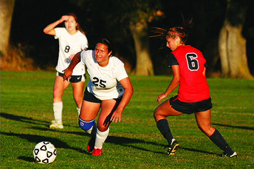 McCall Madriago (right), pictured above challenging a Santa Rosa player in 2014, was selected to the U.S. Women’s Deaf National Team in January. (File photo)
