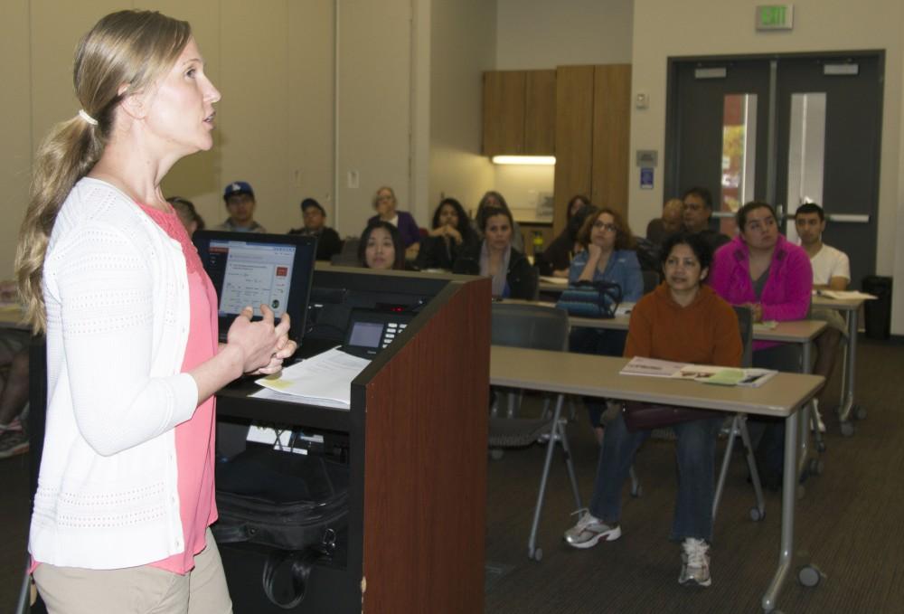 Coordinator for the work experience and internship program Vivian Dillion explains the program to students at the student center on March 31. (Photo by Joe Padilla)