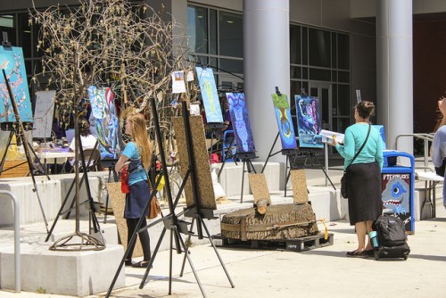 Art panels made from old trash cans by art department students were displayed during the Earth Day  celebration on April 19 and 20. (Photo By itzin Alpizar). 