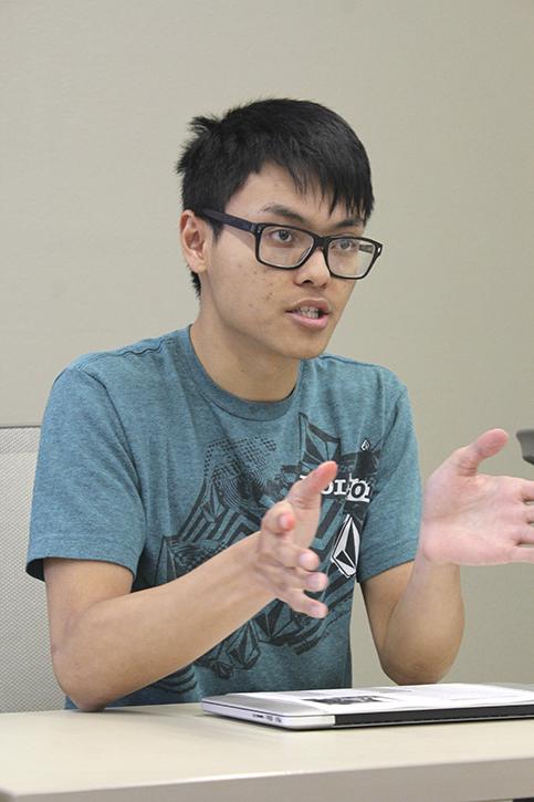 Sen. Kevin Phan explains his resolution suggesting the Los Rios Police Department add more police on campus at the Student Senate meeting Thursday. Debate between board members lasted nearly 20 minutes before voting was postponed. (Photo by Robert Hansen)