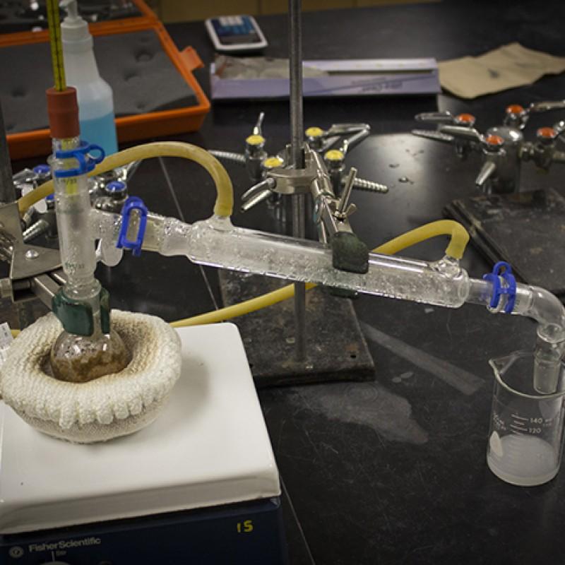 A distillation apparatus heats up cinnamon and water through the round bottom flask, and is cooled down through the condensor tube. The collected distillate contained cinnamaldehyde, the essential oil in cinnamon. (Photo by Timothy Lipuma)