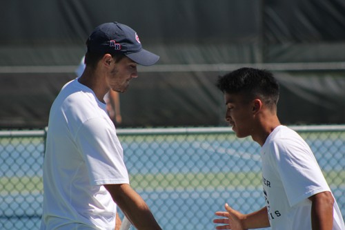 American River College's Cody Duong and Sean McDaniel shake  hands during a doubles match against Modesto Junior College on April 5, 2016 at ARC. Duong and McDaniel won their match 8-4. (Photo by Mack Ervin III)